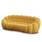A playful bubble football-inspired cream sofa combining inflatable aesthetics with modular lounge functionality, crafted from tear-resistant TPU and eco-friendly memory foam for dynamic living spaces.