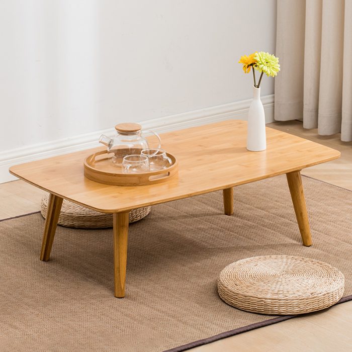 Scandinavian coffee table combines minimalist design with natural wood for versatile elegance.