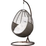 Relax outdoors with a cozy wicker swing chair.