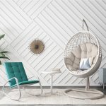 Relax outdoors with a cozy wicker swing chair.