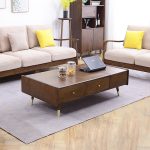 Glass top and brass detailing define this Scandinavian coffee table's understated luxury.