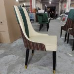 Our contemporary iron dining chair with an upholstered seat combines luxury with comfort, making it a great choice for upscale dining spaces. Ideal for global retailers.