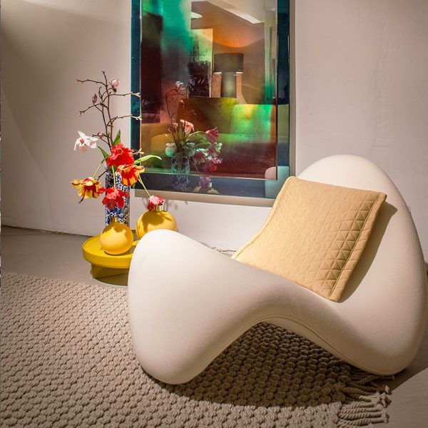 Instagram-famous tongue-shaped chair merges ergonomic curves with vegan leather comfort, becoming a provocative yet functional art piece for trendy spaces.