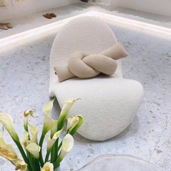 Instagram-famous tongue-shaped chair merges ergonomic curves with vegan leather comfort, becoming a provocative yet functional art piece for trendy spaces.