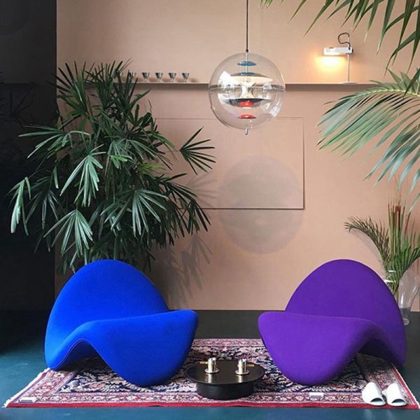 Instagram-famous tongue-shaped chair merges ergonomic curves with vegan leather comfort, becoming a provocative yet functional art piece for trendy spaces.