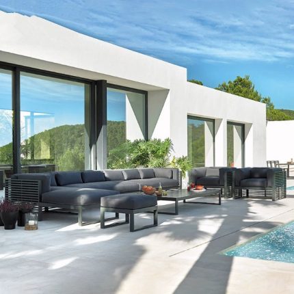 Unwind in luxury with a sophisticated outdoor sofa.