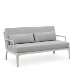 Relax outdoors with a cozy and chic sofa.