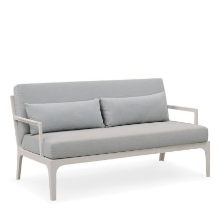 Relax outdoors with a cozy and chic sofa.