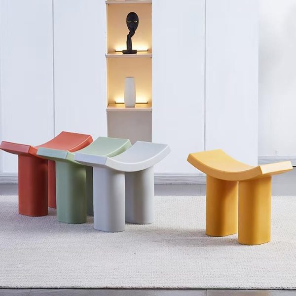 : A Scandinavian-inspired Dumbo-themed shoe storage stool combining whimsical animal charm with minimalist functionality, featuring a cushioned seat and hidden compartment for compact entryway organization.