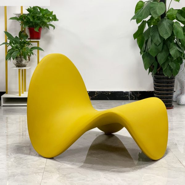 Instagram-famous tongue-shaped chair merges ergonomic curves with vegan leather comfort, becoming a provocative yet functional art piece for trendy spaces.