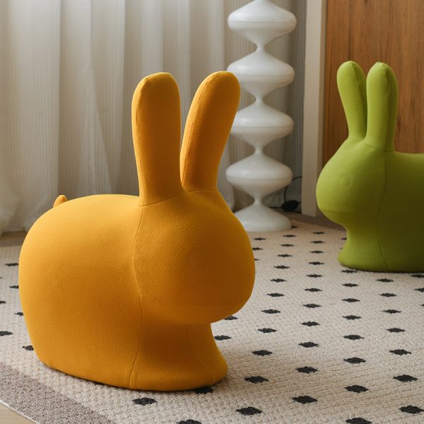 A minimalist modern cartoon animal stool for living rooms, blending playful aesthetics with functional storage, crafted from eco-friendly materials and featuring rounded child-safe edges.