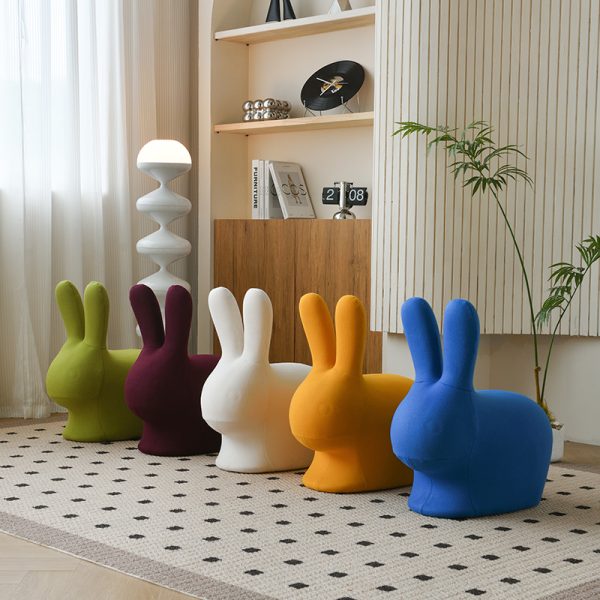 A minimalist modern cartoon animal stool for living rooms, blending playful aesthetics with functional storage, crafted from eco-friendly materials and featuring rounded child-safe edges.