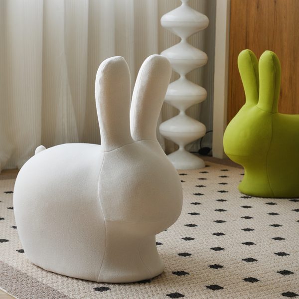 A minimalist modern cartoon animal stool for living rooms, blending playful aesthetics with functional storage, crafted from eco-friendly materials and featuring rounded child-safe edges.